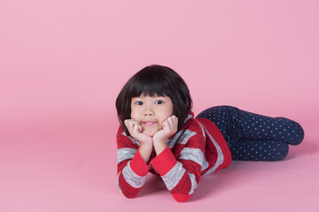 cute girl on pink background, asian kid
