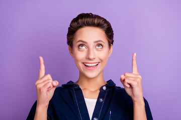 Sticker - Photo of cute brunette millennial lady point look empty space wear jeans shirt isolated on violet color background