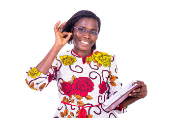 Wall Mural - adult business woman holding a book and making correct gesture.