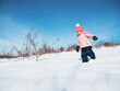 © Nektarstock - Little Girl Walking in Snow
