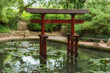 Japanese wooden gazebo in the water of the pond