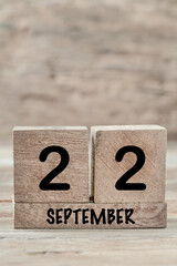 Wall Mural - cube calendar for september on wooden background with copy space