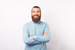 © Vulp - Portrait of a young confident bearded man is smiling at the camera over white background.