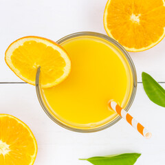 Wall Mural - Orange juice drink on wooden board from above square