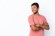 © luismolinero - Young handsome Brazilian man isolated on white background with arms crossed and happy