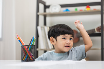 Asian little boy education from home. Developing children's learning before entering kindergarten Practice the skills of drawing and painting.