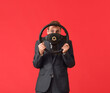 © Pixel-Shot - Young businessman with steering wheel on color background