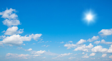 Wall Mural - blue sky with clouds and sun.