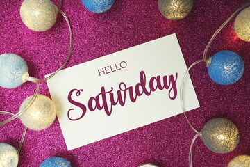 Wall Mural - hello saturday typography text with led cotton ball on pink glitter background