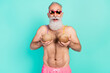Photo of funky crazy foolish man hold two coconut cocktails boobs wear sunglass shorts isolated teal color background