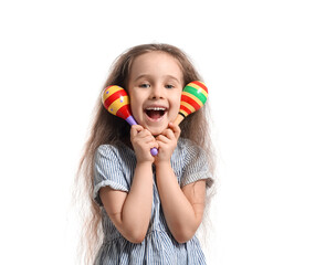 Cute Mexican girl with maracas on white background