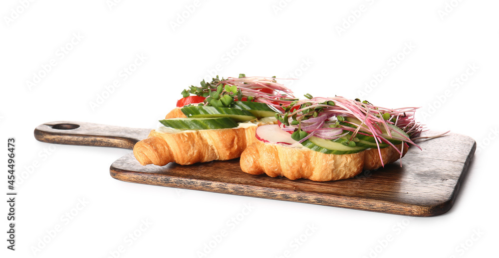 Tasty croissants with vegetables and micro green on white background