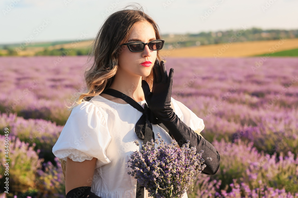 Beautiful young woman in lavender field