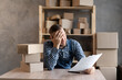 © Andrii Lysenko - Frustrated frustrated young business owner reading bad news in mail letter, paper document, depressed tense guy worried about high tax bill, bad debt notice, money problem