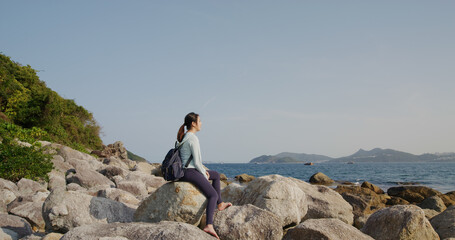 Wall Mural - Woman sit on the rock