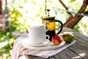 Wall Mural - Breakfast serving for two, tea cups and fruits