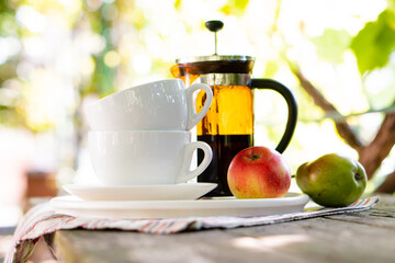 Wall Mural - Breakfast serving for two, tea cups and fruits