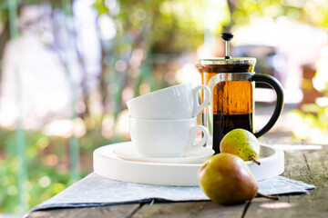 Wall Mural - Breakfast serving for two, tea cups and fruits