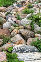 Wall Mural - Granite boulders among the grass as a structural background.