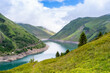 © Anna - Beautiful summer panorama of the mountain lake in Vaujany, France. Cloudy  view in the French Alps, Europe. Scenery landscape of high plateau.