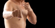 © kaew6566 - Attack, aggression, aggressive, power strong, survival sign. Hands of fighter man posing punch fight while standing over isolated black background.