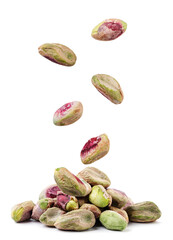 Wall Mural - Peeled pistachios fall on a pile on a white background. Isolated