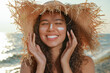 © New Africa - Happy African American woman with sun protection cream on face at beach