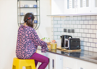 woman cleaning kitchen