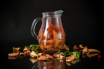 Poster - sweet cool compote boiled from various dried fruits, in a glass decanter