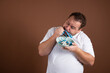 © vladorlov - Diet and healthy lifestyle. Funny fat man.