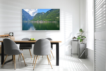 Wall Mural - Modern wide screen TV on white wall in room with stylish furniture