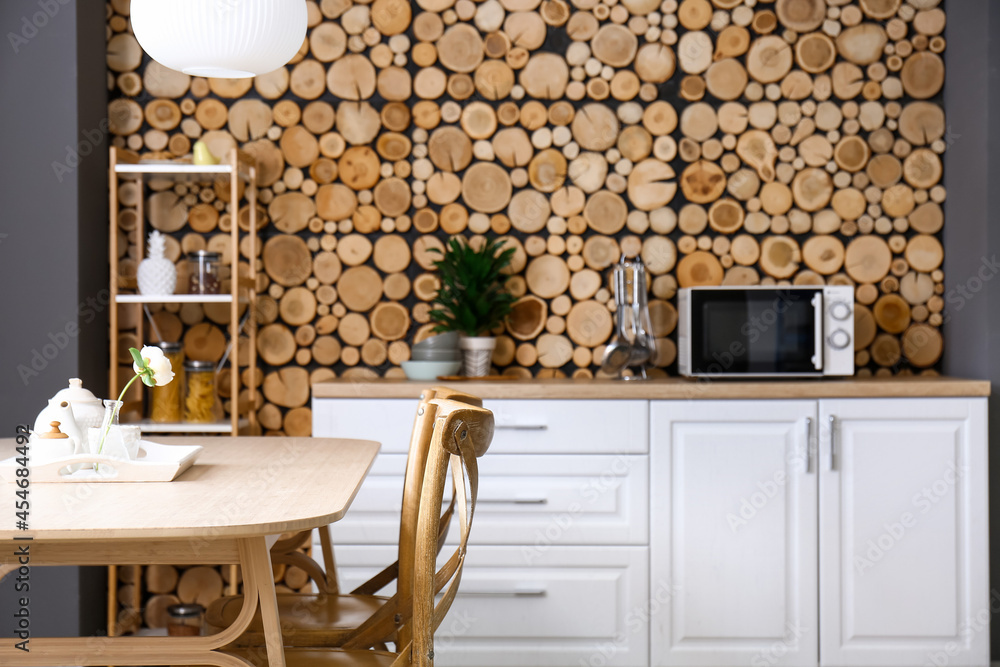 Interior of stylish kitchen with dining table