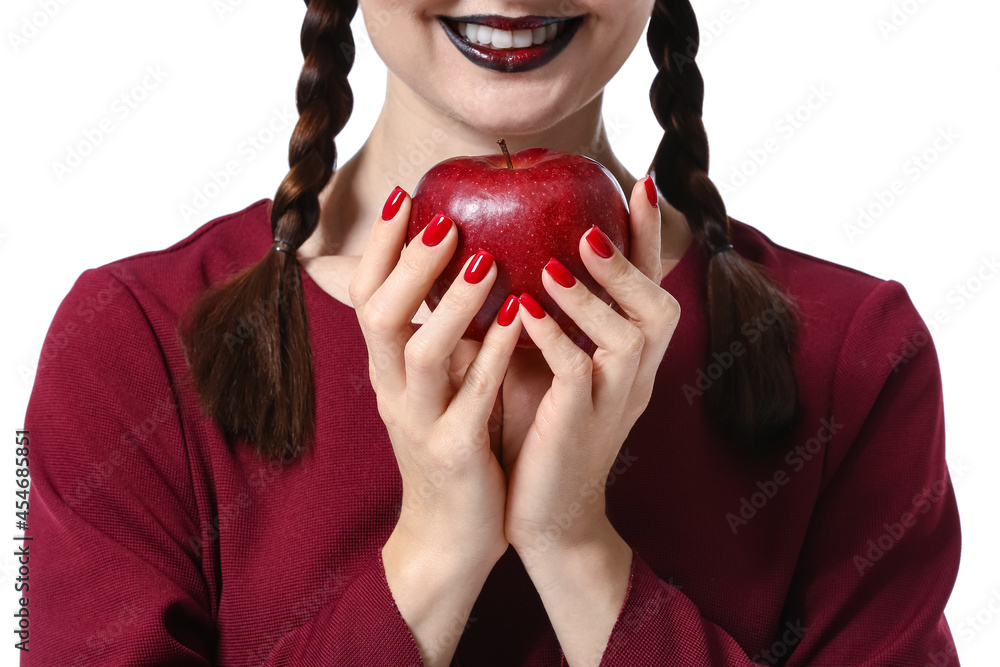 Young witch with apple on white background, closeup
