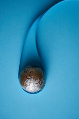 Ecology and Pollution Concept : Blue planet earth globe in water drop with blue background