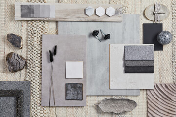 Flat lay of creative architect moodboard composition with samples of building, beige textile and natural materials and personal accessories. Top view, template.