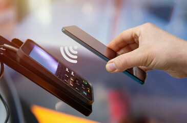 Wall Mural - making mobile payments from pos device via mobile phone