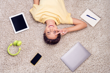 Poster - Top above high angle photo of friendly lady lay floor carpet show v-sign wear yellow t-shirt in modern house indoors