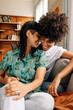 © (JLco) Julia Amaral - Carefree lesbian couple spending quality time together at home