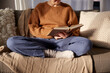 © Syda Productions - people, season and leisure concept - close up of woman in warm sweater reading book at home