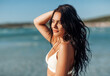 © Syda Productions - people, summer and swimwear concept - beautiful young woman in bikini swimsuit on beach