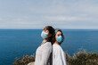 © Eva - two caucasian women outdoors wearing face mask keeping social distance in Pandemic during corona virus. Nature and mountain