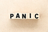 Fototapeta Sawanna - Alphabet letter block in word panic on wood background