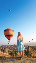 Woman In Hot Air Balloon Against Clear Sky