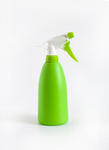 Green Spray Bottle On White Background