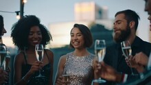 Stylish Group Of Friends Celebrating Making Toast To Glamorous Party Event Drinking Champagne At Formal Social Gathering Enjoying Rooftop Celebration At Sunset 4k