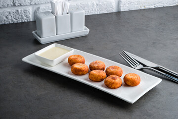 Sticker - Homemade cottage cheese pancakes with condensed milk on gray background, breakfast