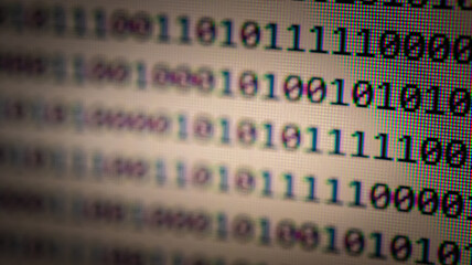 Abstract background of digital binary code of software. Programming software code on computer screen which develop by the programmer to solve the business requirement.	

