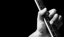Close Up Male Musician Left Hand Playing Chord On Electric Guitar Neck. Music Background