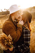 © maxbelchenko - Lovely hipster couple enjoying each other in the autumn park. Nice autumn day. Young couple walking and hugging outdoors, The concept of youth, love and lifestyle.