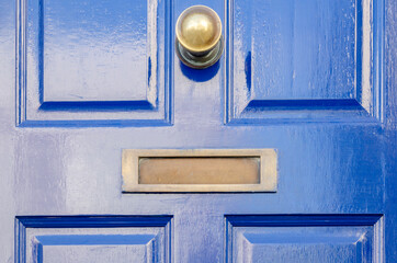 Old letterbox in the door, traditional way of delivering letters to the house, old mailbox